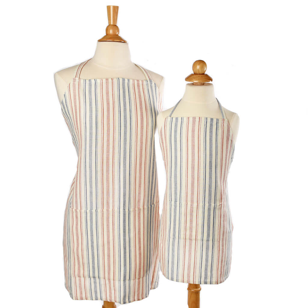 Child and adult matching aprons cream, pumpkin, and blue gray stripes