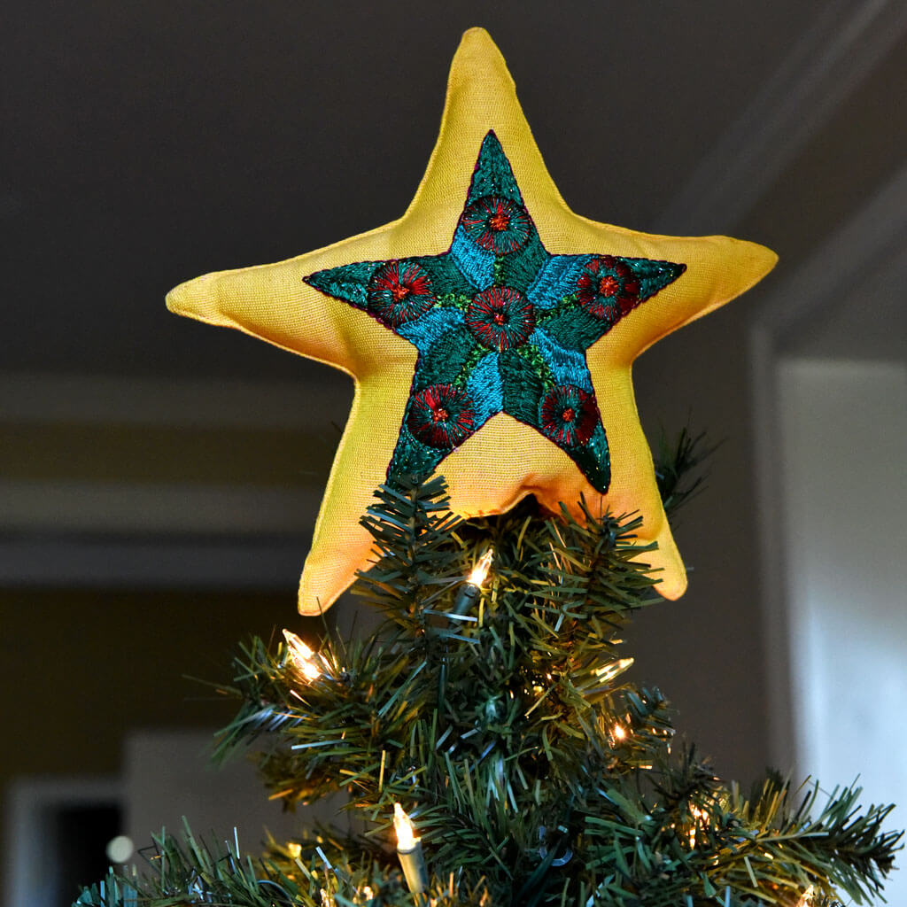 Hand embroidery Christmas tree topper, each one with unique designs.