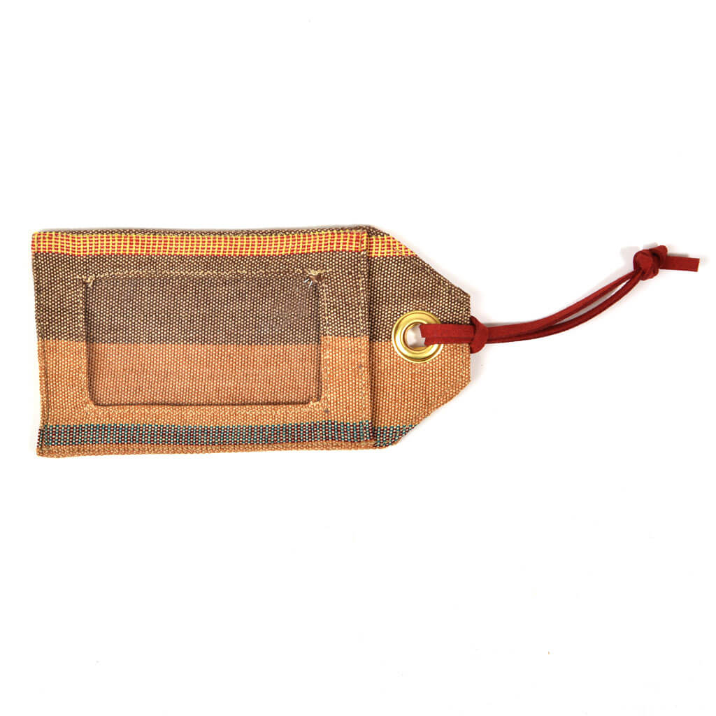 Caramel with brown luggage tag. 