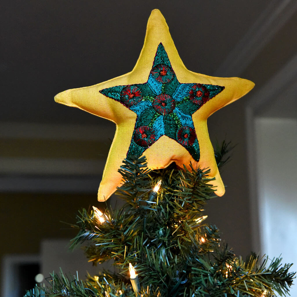 Hand embroidery Christmas tree topper, each one with unique designs. 