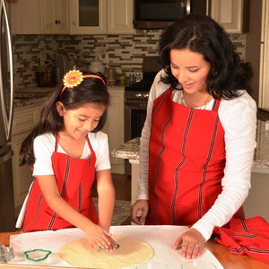Red, white and black child and adult matching aprons. 