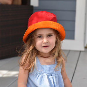 Bright red child bucket hat.